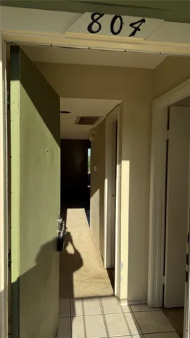 a kitchen with stainless steel appliances granite countertop a refrigerator a sink and a stove