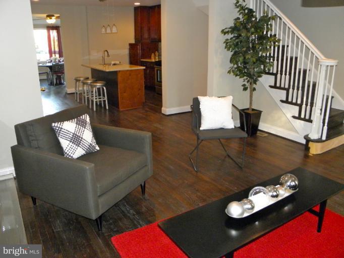 3960 S Street Southeast Washington, DC 20020 - Photo 1 of 27 a living room with furniture and wooden floor