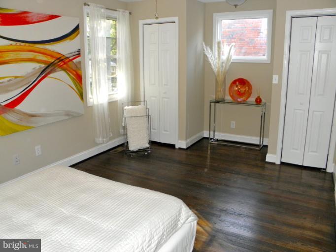 3960 S Street Southeast Washington, DC 20020 - Photo 21 of 27 a view of a room with wooden floor and windows