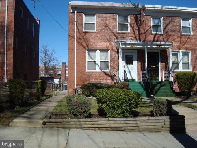 3960 S Street Southeast Washington, DC 20020 - Photo 27 of 27 a front view of a house with a yard