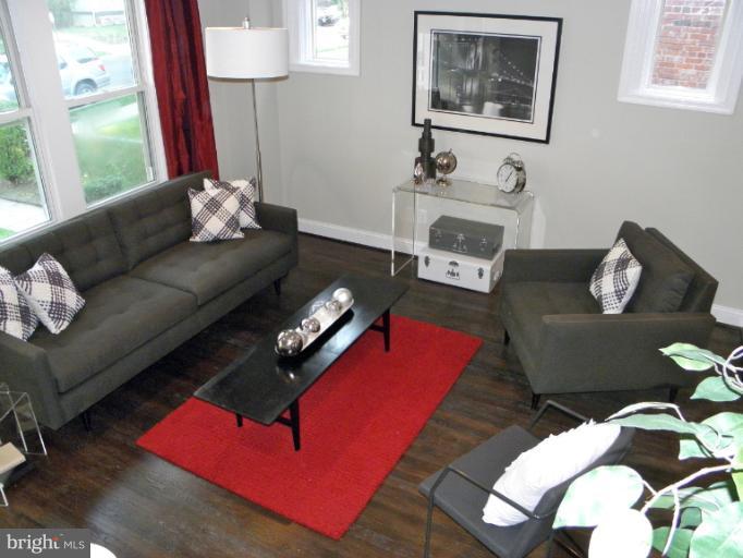 3960 S Street Southeast Washington, DC 20020 - Photo 4 of 27 a living room with furniture and a fireplace