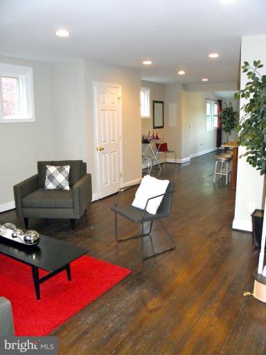 3960 S Street Southeast Washington, DC 20020 - Photo 5 of 27 a living room with furniture a rug and a pool table