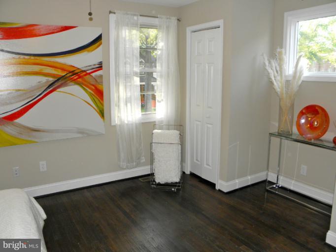 3960 S Street Southeast Washington, DC 20020 - Photo 8 of 27 a view of a room with wooden floor and windows