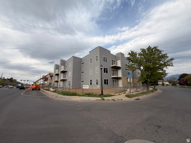 1652 North Main Street, Unit 30 Layton, UT 84041 - Photo 1 of 4 New construction multi-story building featuring light gray siding and multiple balconies with white railings