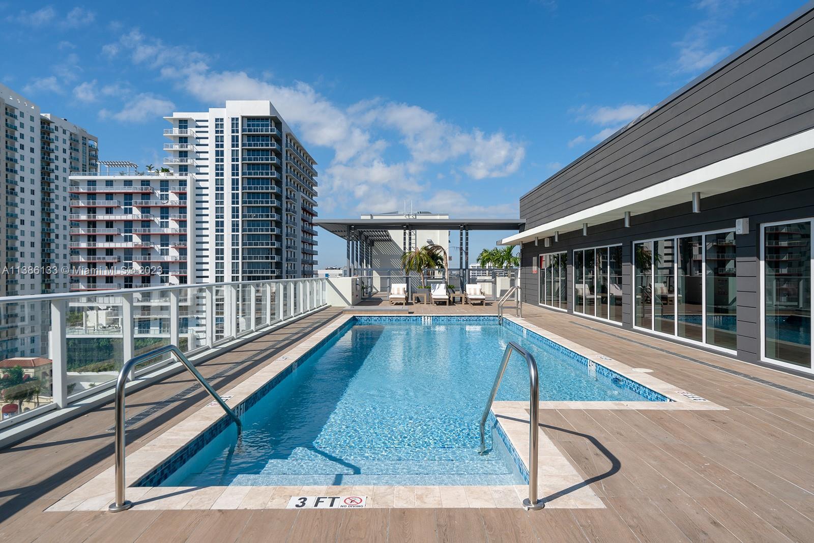 321 Northeast 26th Street, Unit 615 Miami, FL 33137 - Photo 11 of 15 a view of swimming pool with outdoor seating