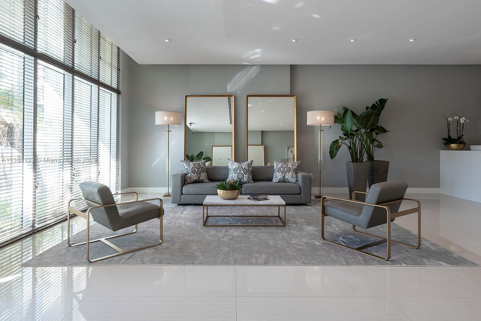 321 Northeast 26th Street, Unit 615 Miami, FL 33137 - Photo 4 of 15 a living room with furniture and floor to ceiling windows