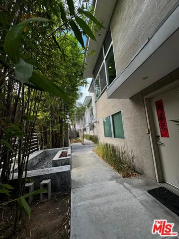 a view of a house with a tree