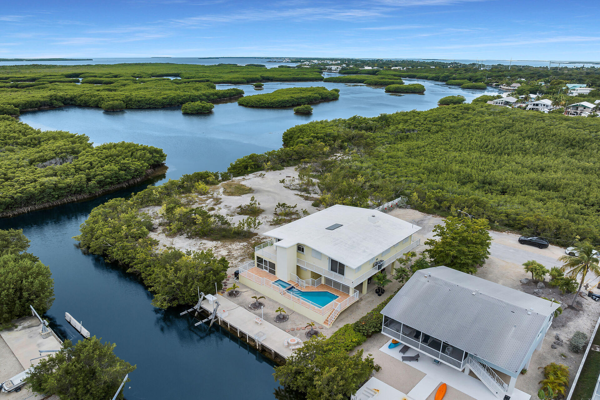 85 Ocean Shores Drive Key Largo, FL 33037 - Photo 11 of 77 an aerial view of a residential houses with outdoor space and lake view