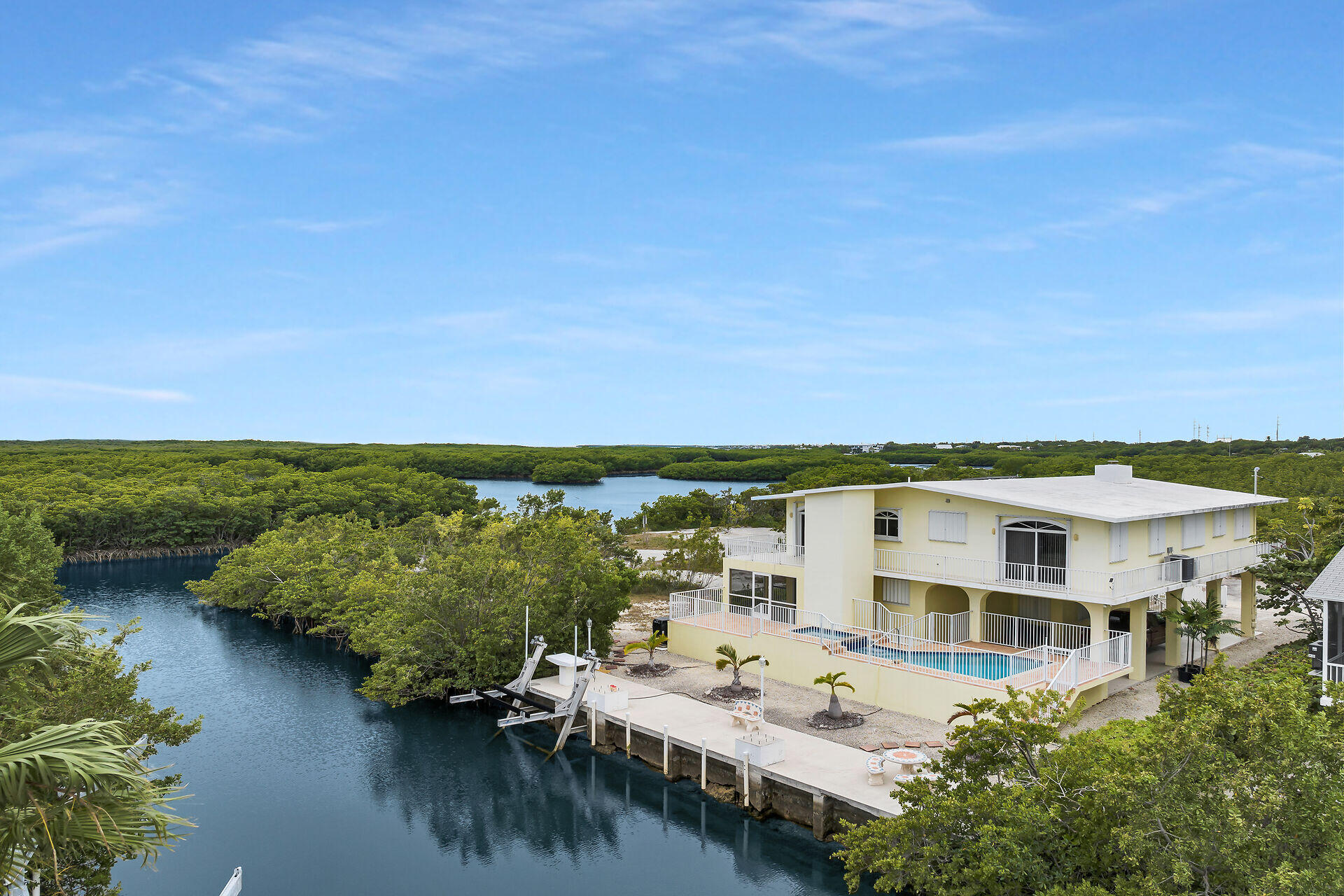 85 Ocean Shores Drive Key Largo, FL 33037 - Photo 12 of 77 an aerial view of residential house with outdoor space and lake view