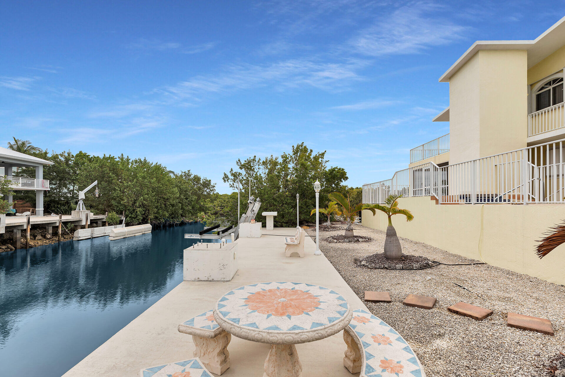 85 Ocean Shores Drive Key Largo, FL 33037 - Photo 19 of 77 a view of a swimming pool with a patio