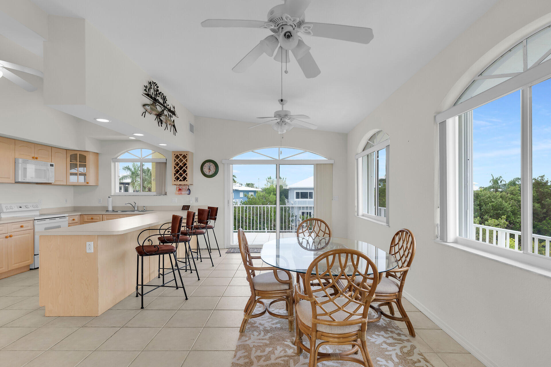 85 Ocean Shores Drive Key Largo, FL 33037 - Photo 40 of 77 a dining room with furniture a chandelier and window