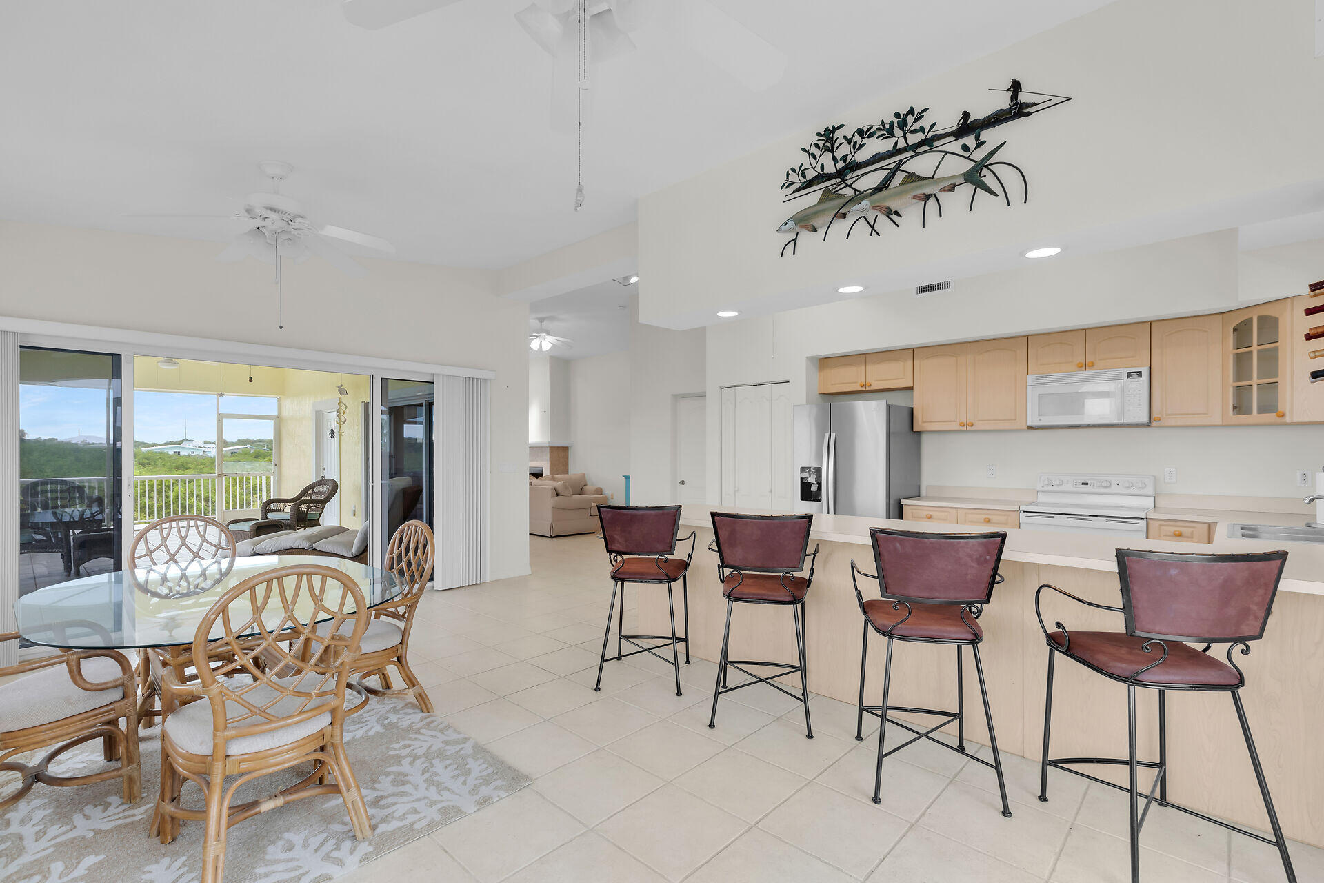 85 Ocean Shores Drive Key Largo, FL 33037 - Photo 42 of 77 a view of a dining room with furniture