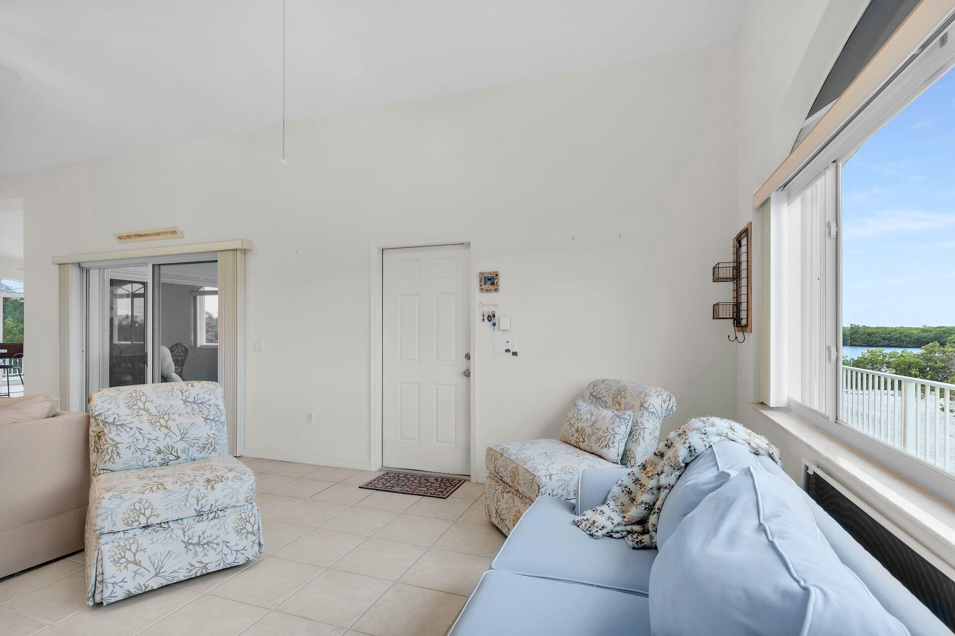85 Ocean Shores Drive Key Largo, FL 33037 - Photo 51 of 77 a living room with furniture and a large window