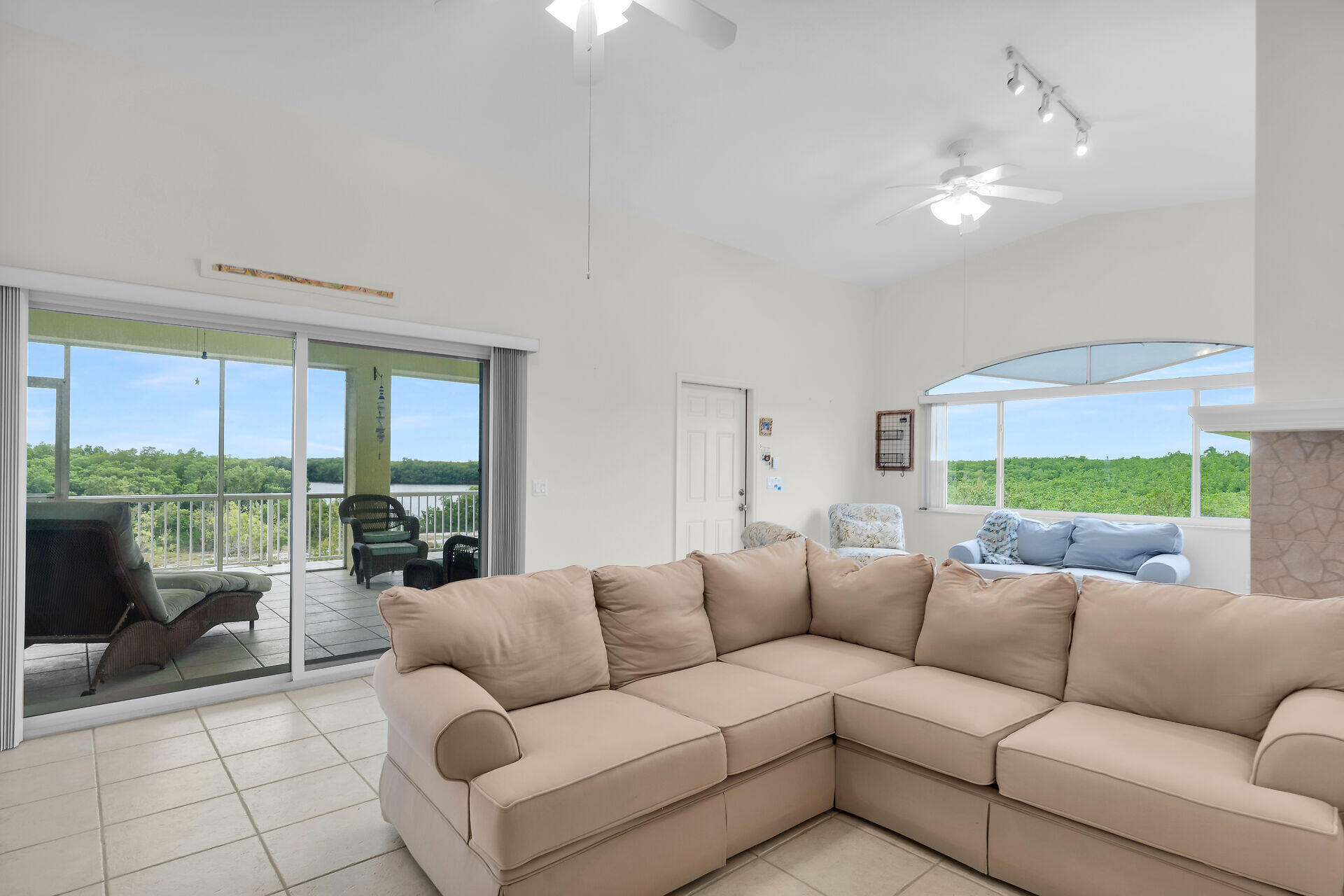 85 Ocean Shores Drive Key Largo, FL 33037 - Photo 54 of 77 a living room with furniture and a large window