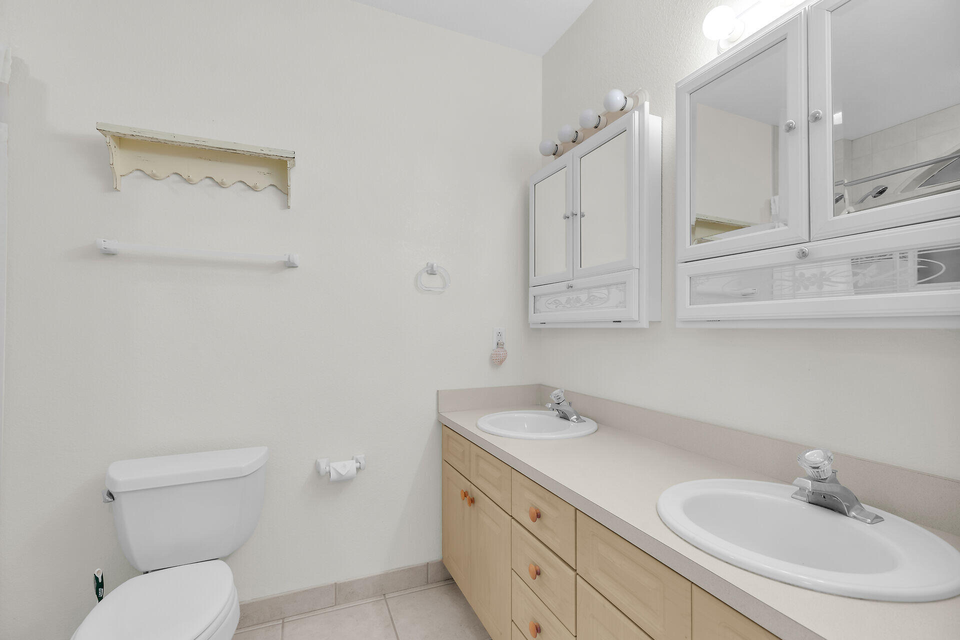 85 Ocean Shores Drive Key Largo, FL 33037 - Photo 57 of 77 a bathroom with a sink a toilet and a mirror