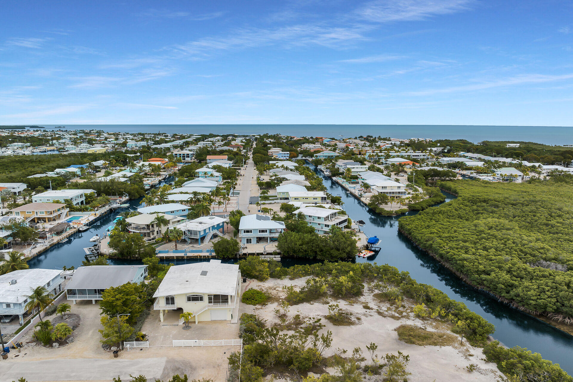 85 Ocean Shores Drive Key Largo, FL 33037 - Photo 6 of 77 an aerial view of residential building and lake