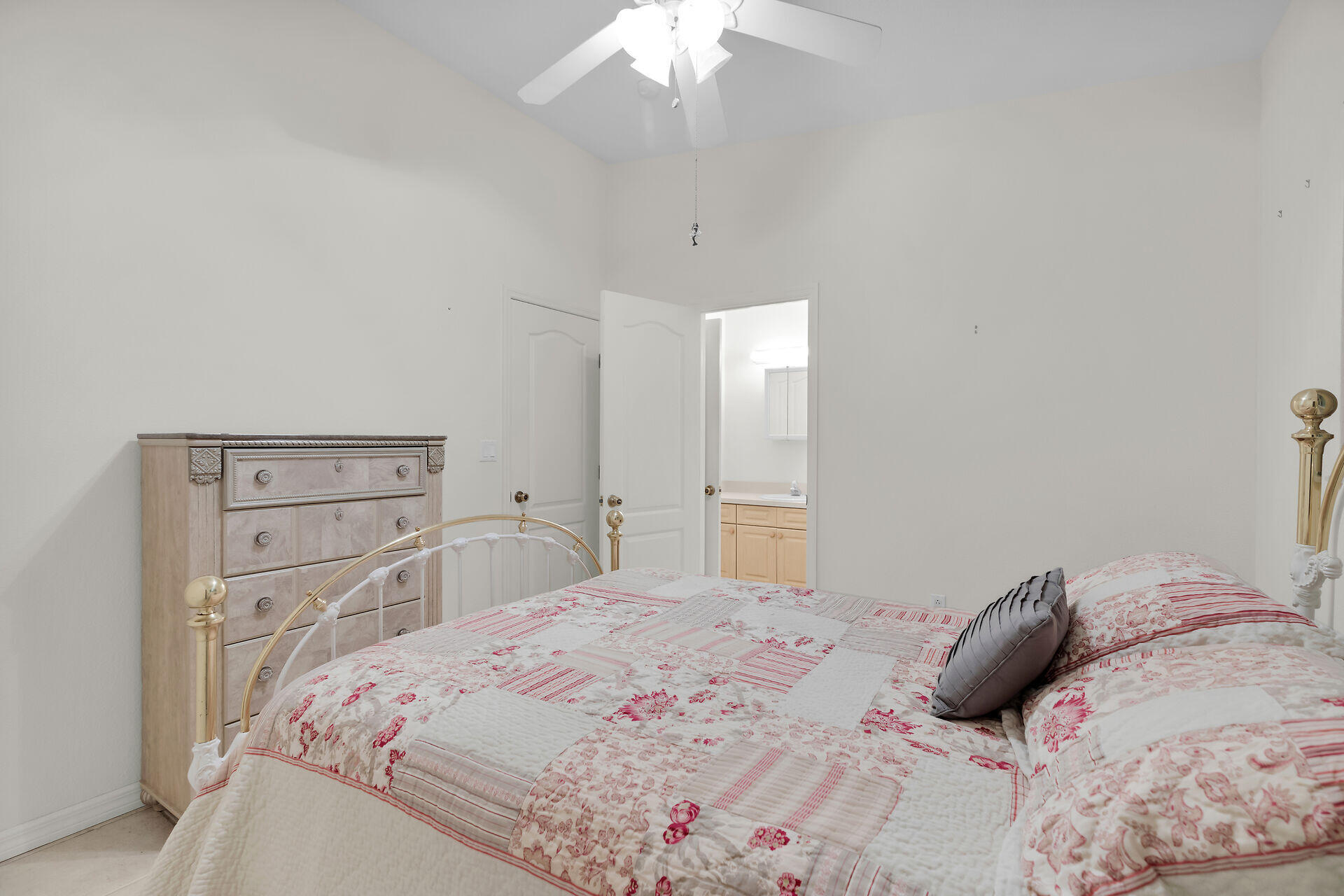 85 Ocean Shores Drive Key Largo, FL 33037 - Photo 66 of 77 a bedroom with a bed and a chandelier