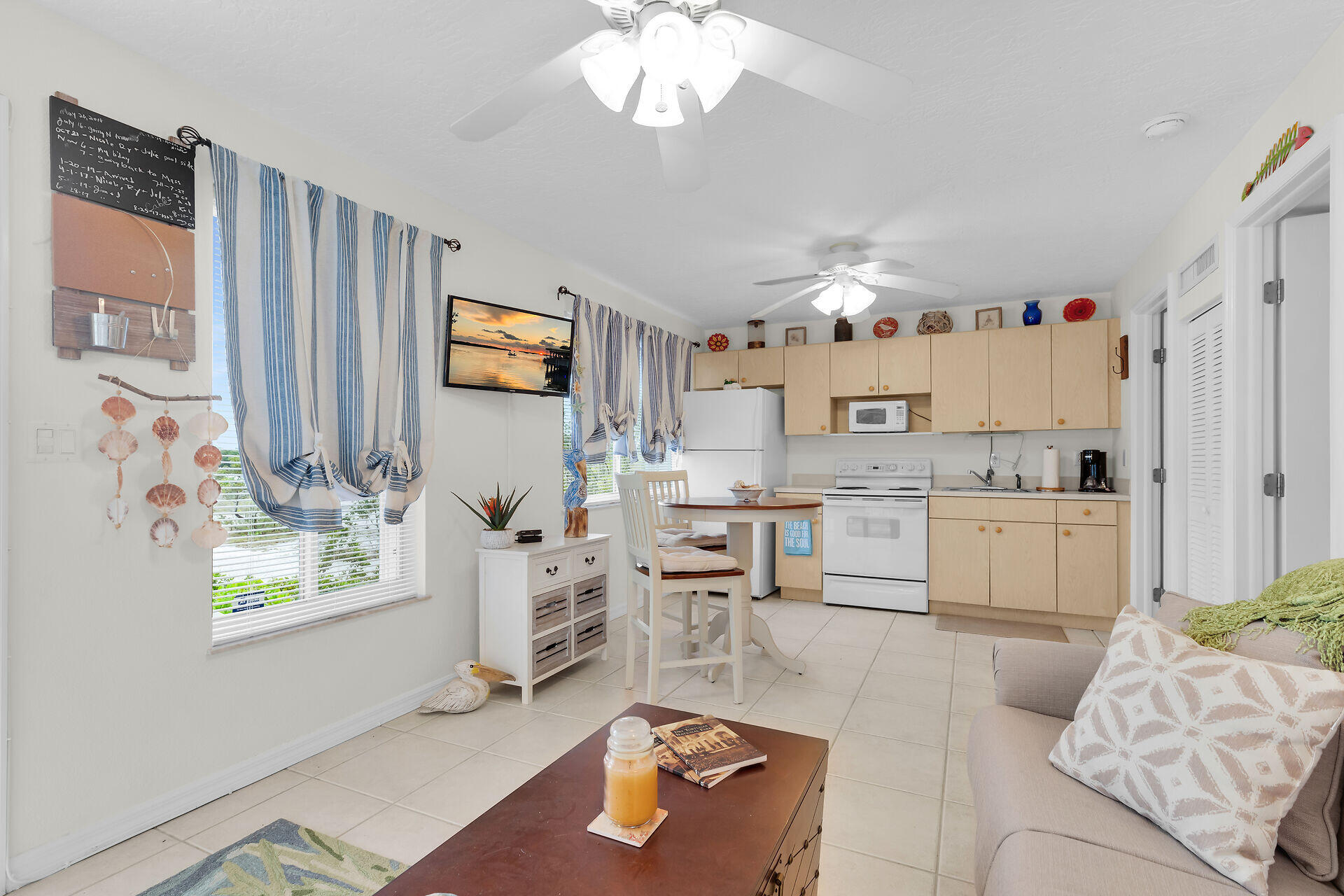 85 Ocean Shores Drive Key Largo, FL 33037 - Photo 68 of 77 a living room with kitchen island furniture and a window
