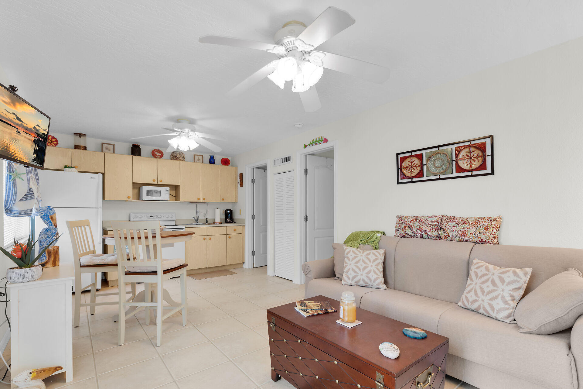 85 Ocean Shores Drive Key Largo, FL 33037 - Photo 69 of 77 a living room with furniture and a chandelier