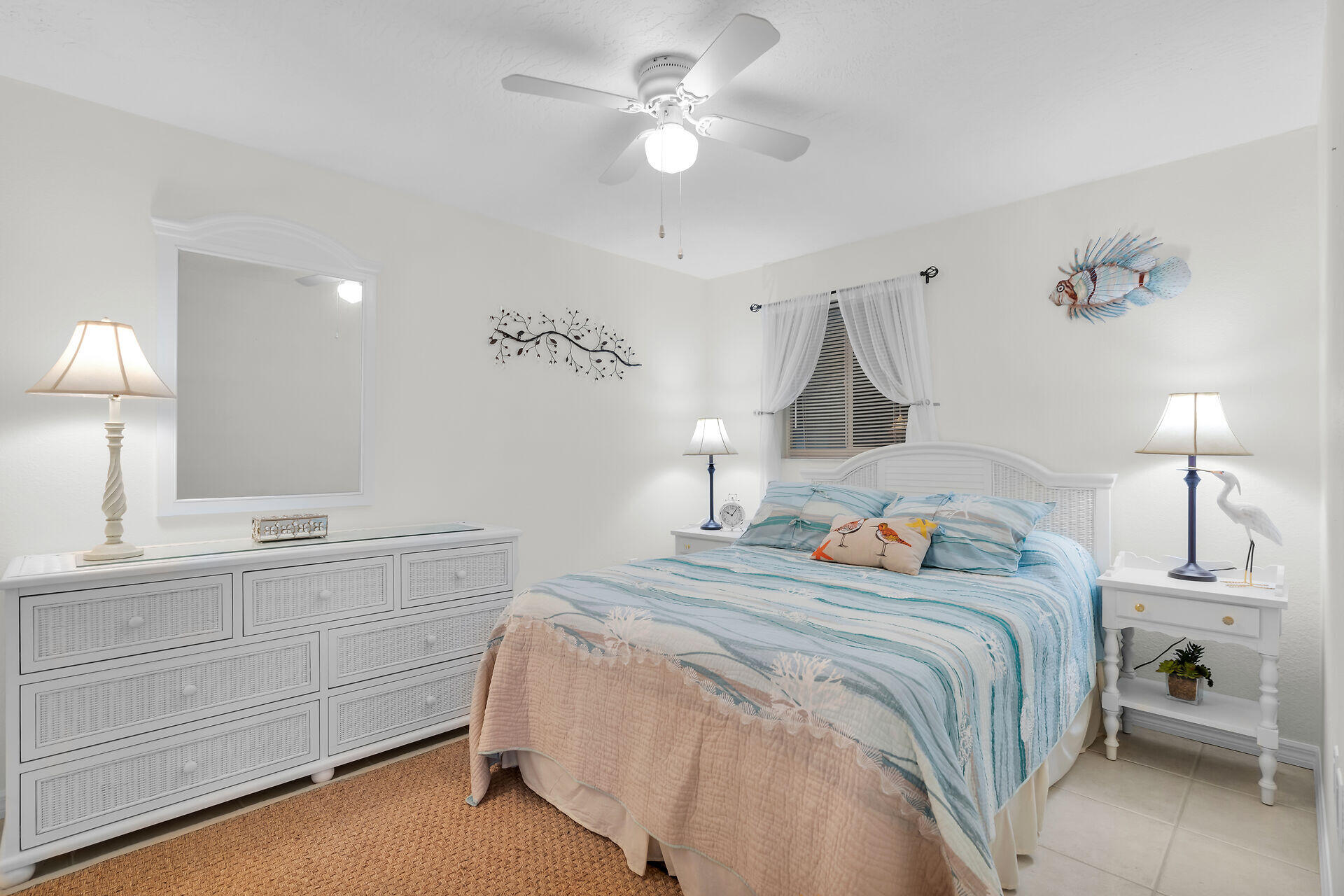 85 Ocean Shores Drive Key Largo, FL 33037 - Photo 72 of 77 a bedroom with a bed and a lamp on dresser