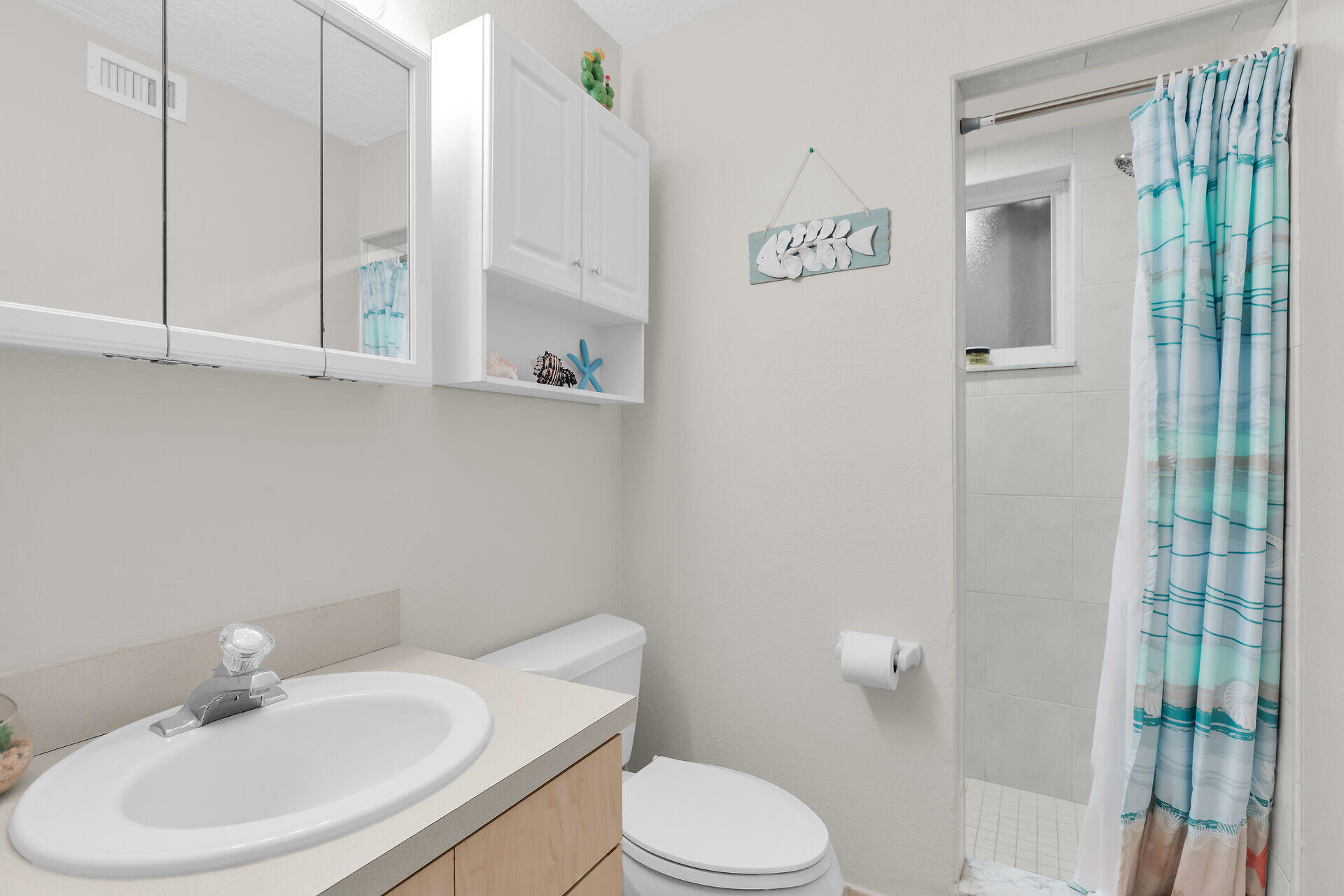 85 Ocean Shores Drive Key Largo, FL 33037 - Photo 74 of 77 a bathroom with a sink a toilet and shower