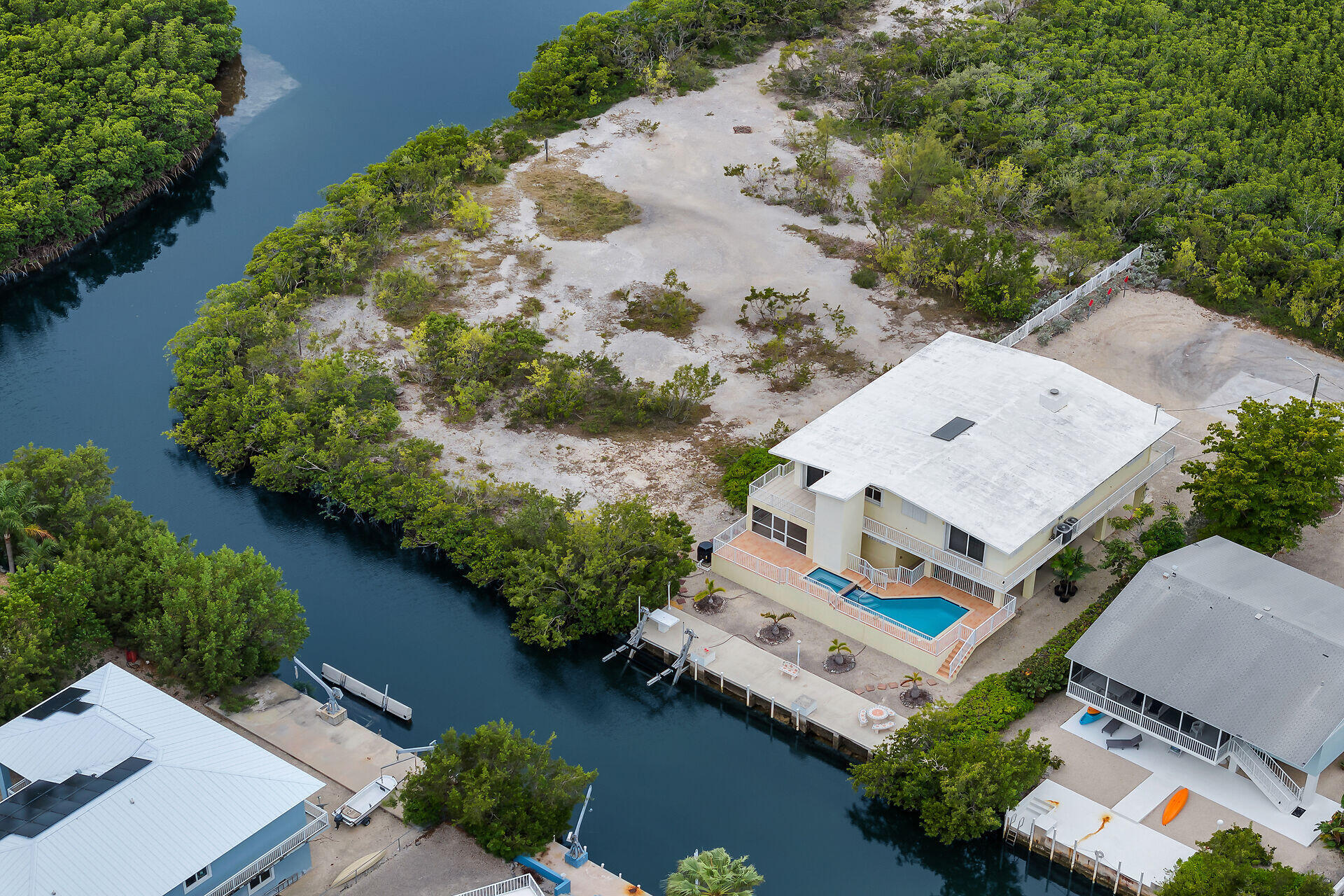 85 Ocean Shores Drive Key Largo, FL 33037 - Photo 10 of 77 an aerial view of a house with a yard