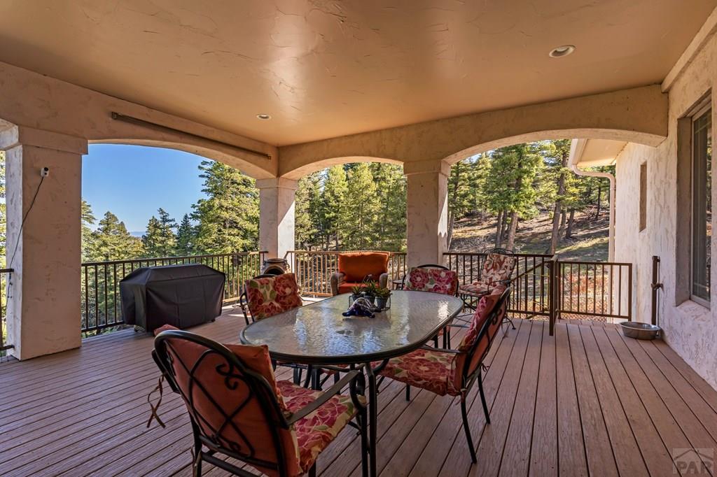 8760 Ridge Road Beulah, CO 81023 - Photo 33 of 45 a dining room with furniture window and wooden floor