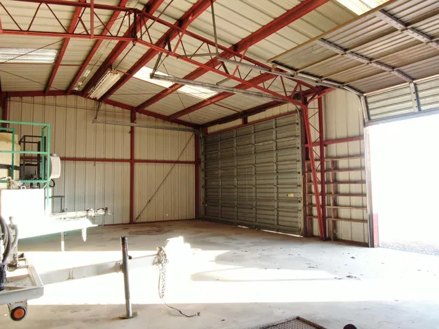 a view of a street with a building in the background