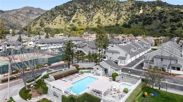 a view of a large building with mountains in the background