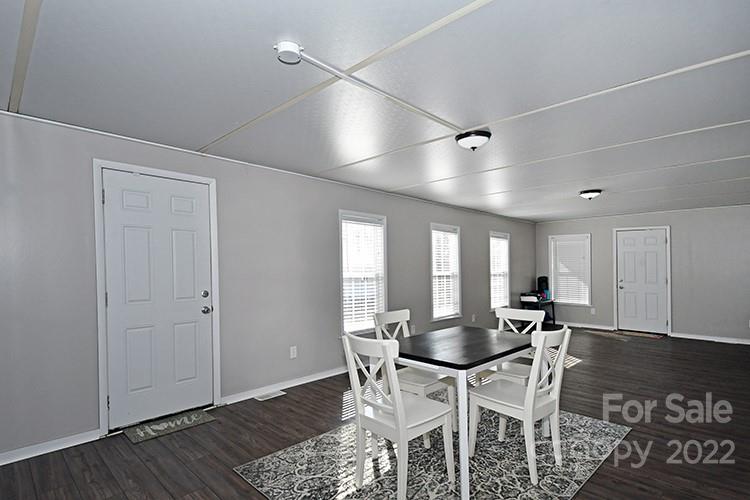 216 Jones Road Mocksville, NC 27028 - Photo 14 of 48 a view of a dining room with furniture and wooden floor