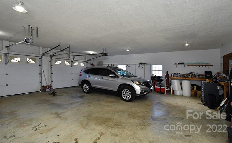 216 Jones Road Mocksville, NC 27028 - Photo 24 of 48 a view of a garage with parked cars