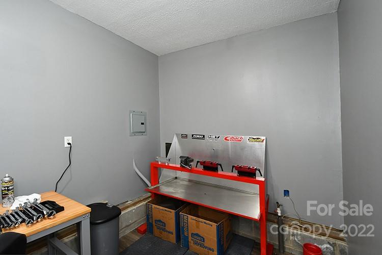 216 Jones Road Mocksville, NC 27028 - Photo 28 of 48 a room with furniture and a desk