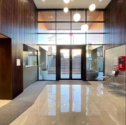 a view of a building with glass windows and door