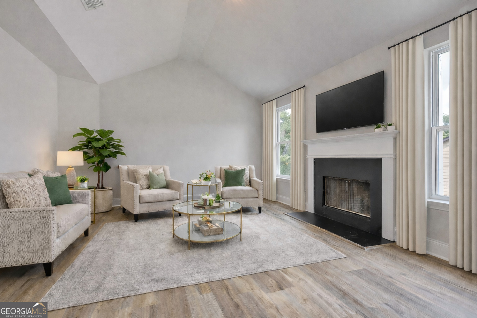 28 Fox Ridge Drive Newnan, GA 30265 - Photo 26 of 47 a living room with furniture a fireplace and a flat screen tv