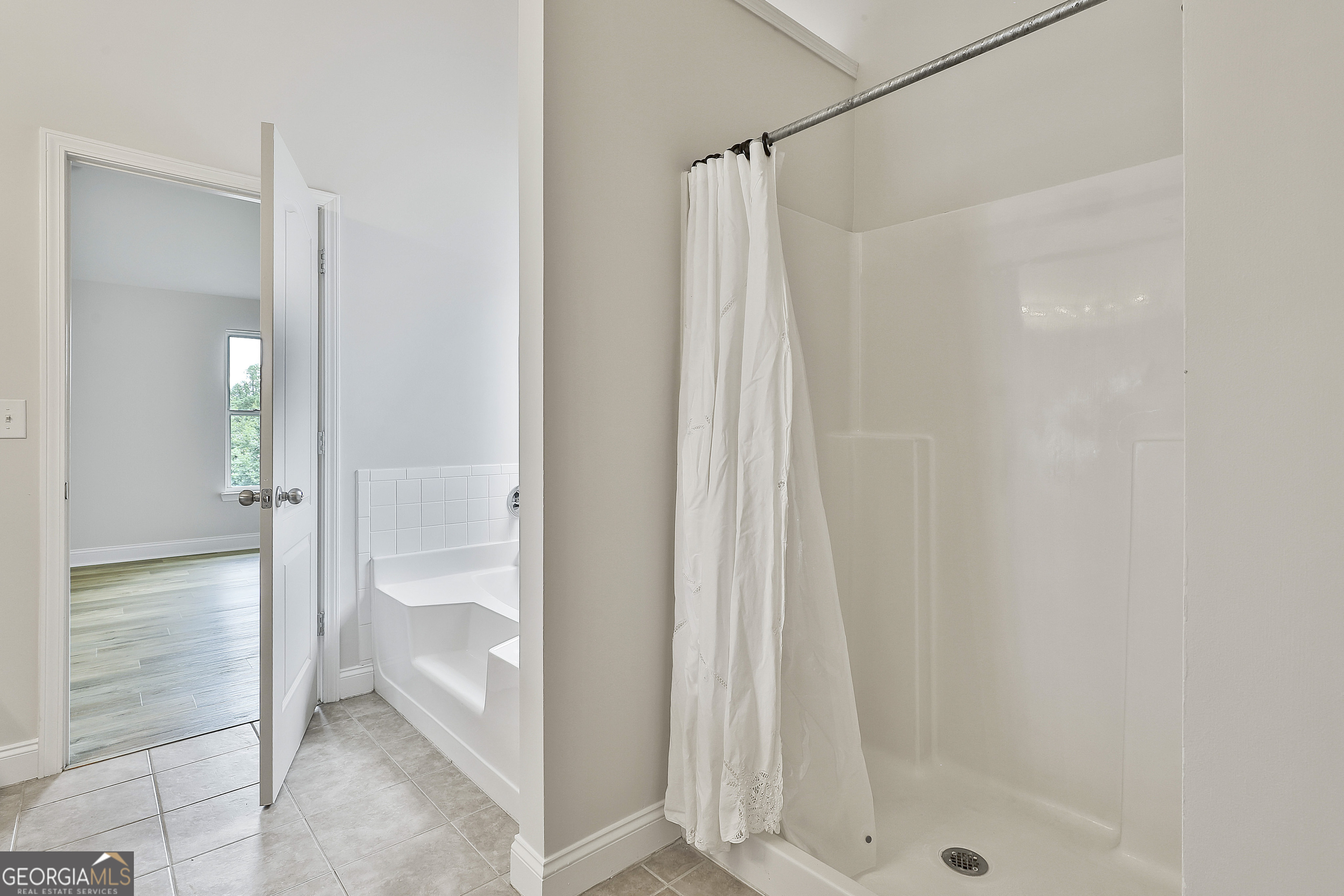 28 Fox Ridge Drive Newnan, GA 30265 - Photo 29 of 47 a bathroom with a shower and a sink