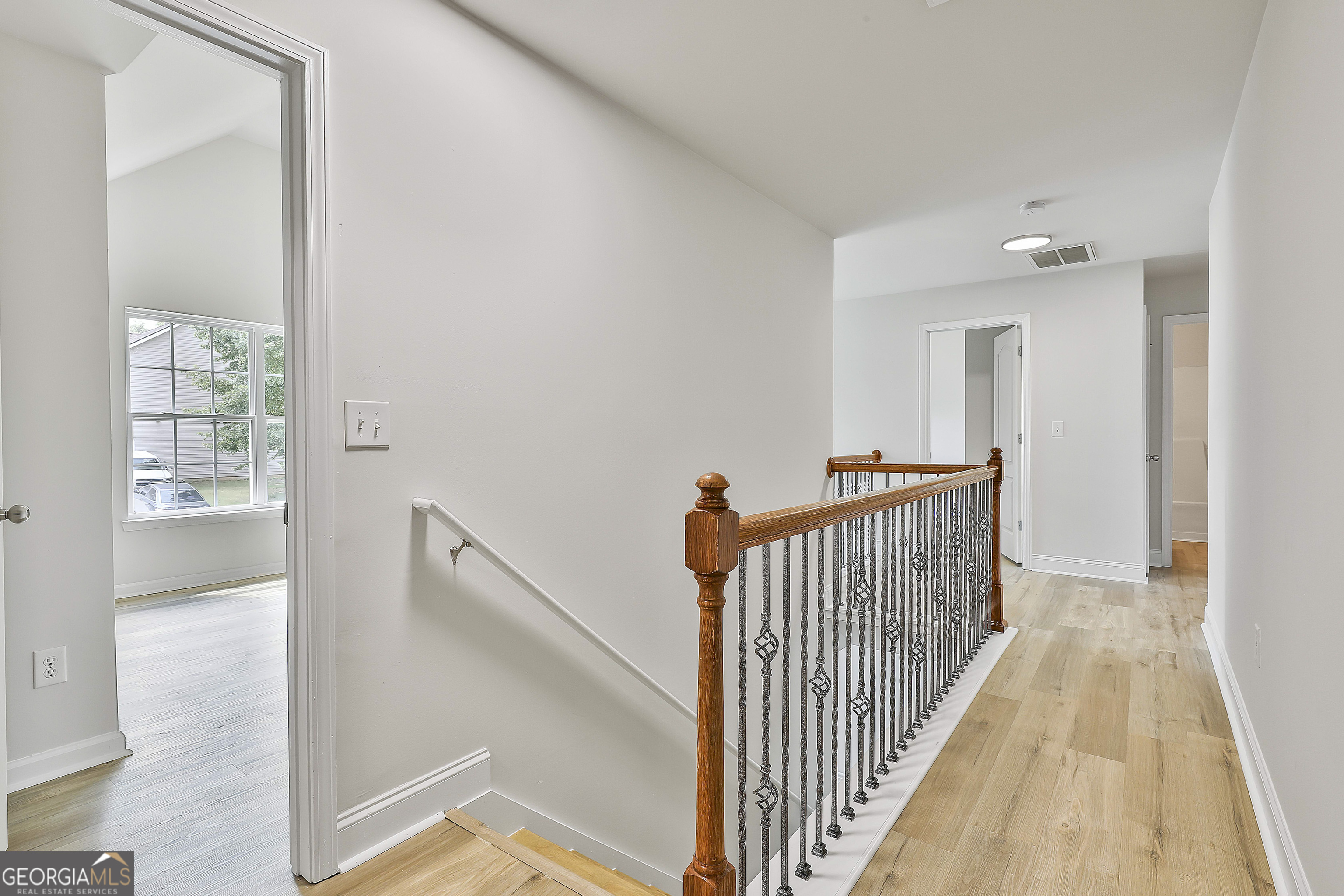 28 Fox Ridge Drive Newnan, GA 30265 - Photo 32 of 47 a view of a hallway with windows and stairs