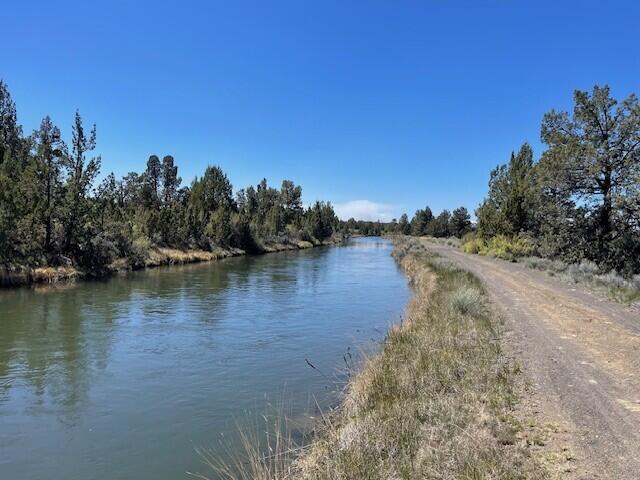61590 Gribbling Road, Unit LOT 2 Bend, OR 97701 - Photo 11 of 12 a view of a lake with houses