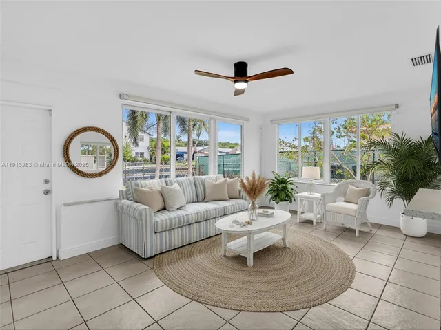a view of a house with a backyard and a patio