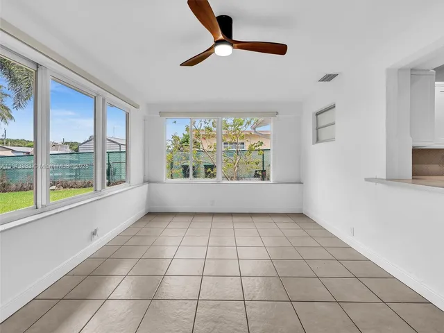 a view of backyard with a garden and trees