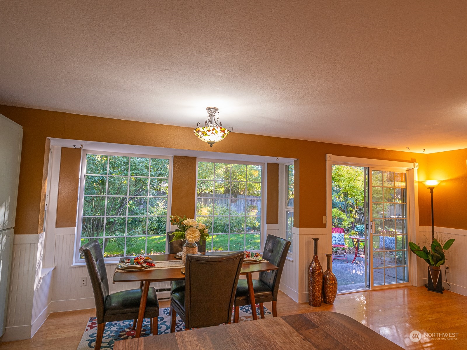 21425 Damson Road Bothell, WA 98021 - Photo 11 of 25 a view of a dining room with furniture window and outside view