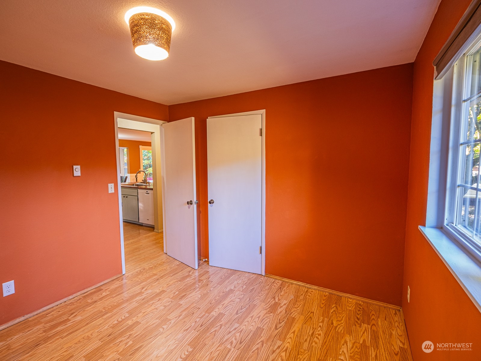 21425 Damson Road Bothell, WA 98021 - Photo 13 of 25 wooden floor in an empty room with a window