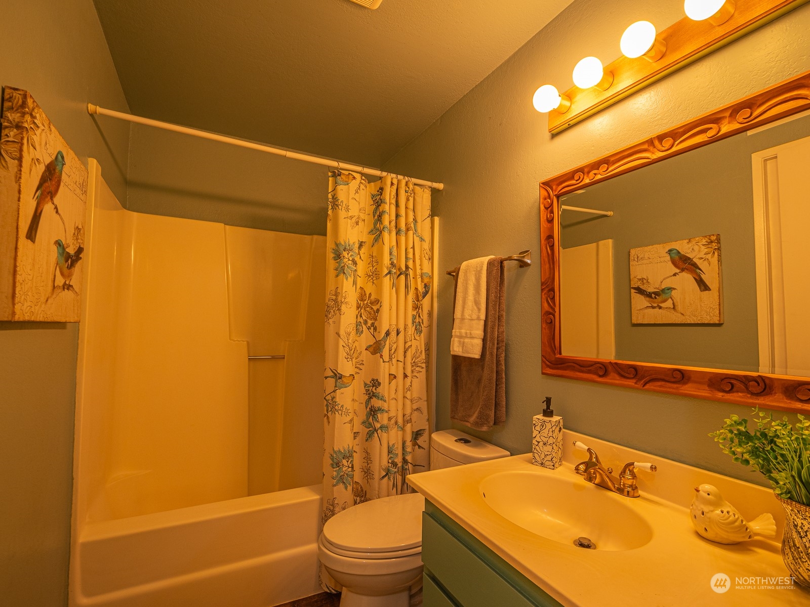21425 Damson Road Bothell, WA 98021 - Photo 14 of 25 a bathroom with a granite countertop sink toilet and shower