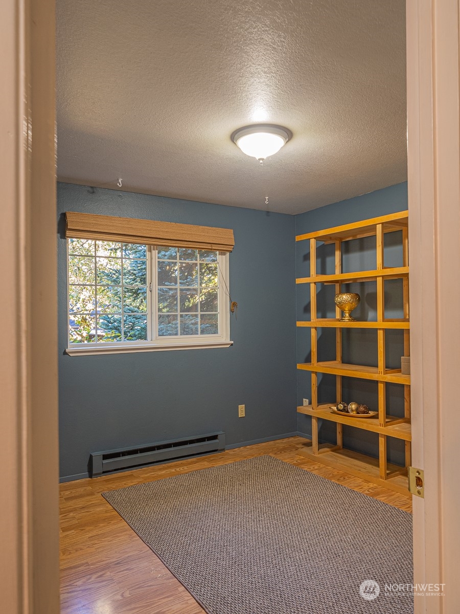 21425 Damson Road Bothell, WA 98021 - Photo 15 of 25 an empty room with a empty space and windows