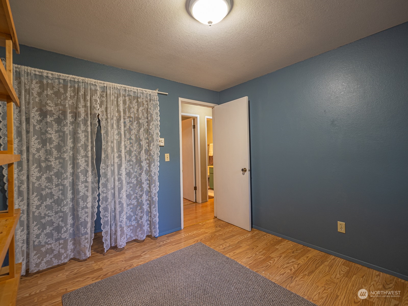 21425 Damson Road Bothell, WA 98021 - Photo 16 of 25 a view of room with a ceiling fan and window