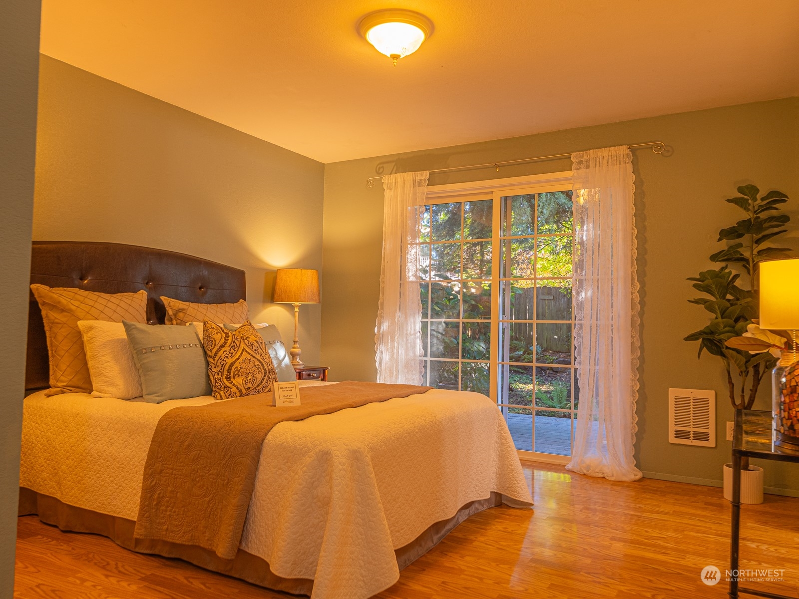 21425 Damson Road Bothell, WA 98021 - Photo 17 of 25 a bed sitting in a bedroom next to a window