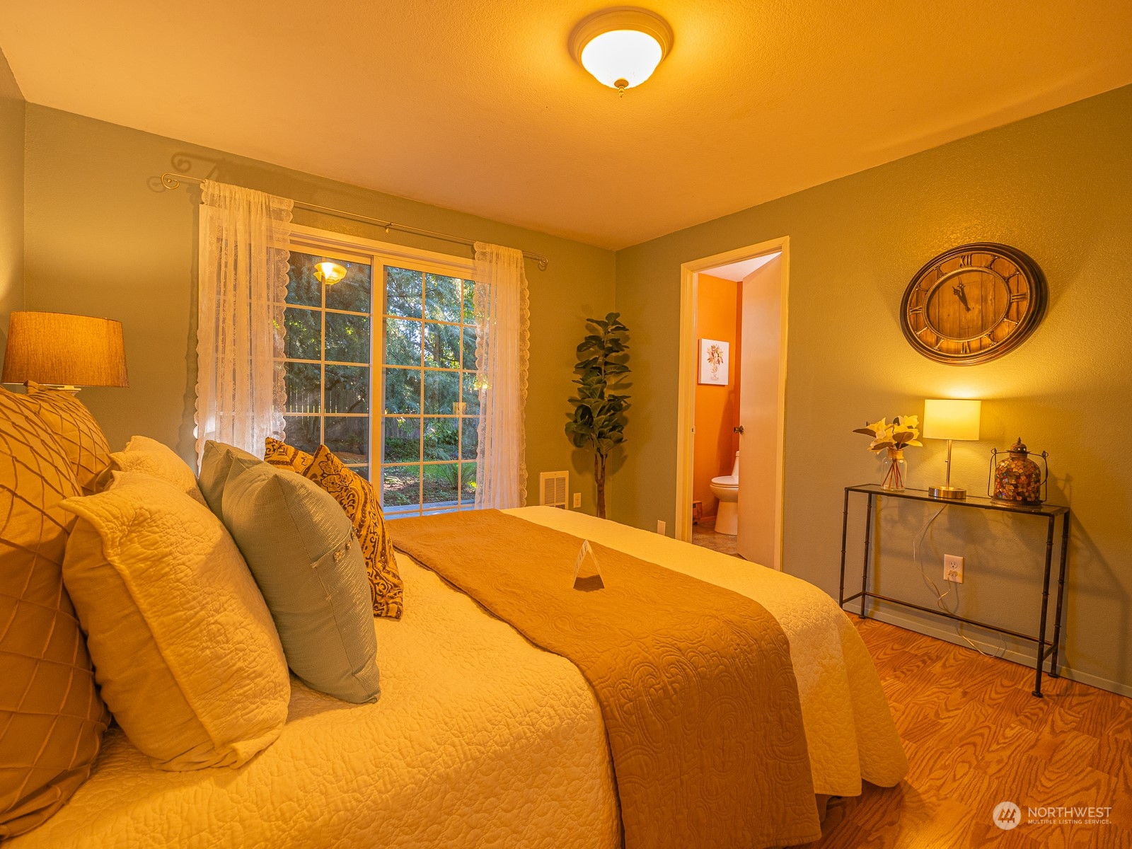 21425 Damson Road Bothell, WA 98021 - Photo 18 of 25 a bed sitting in a bedroom next to a window