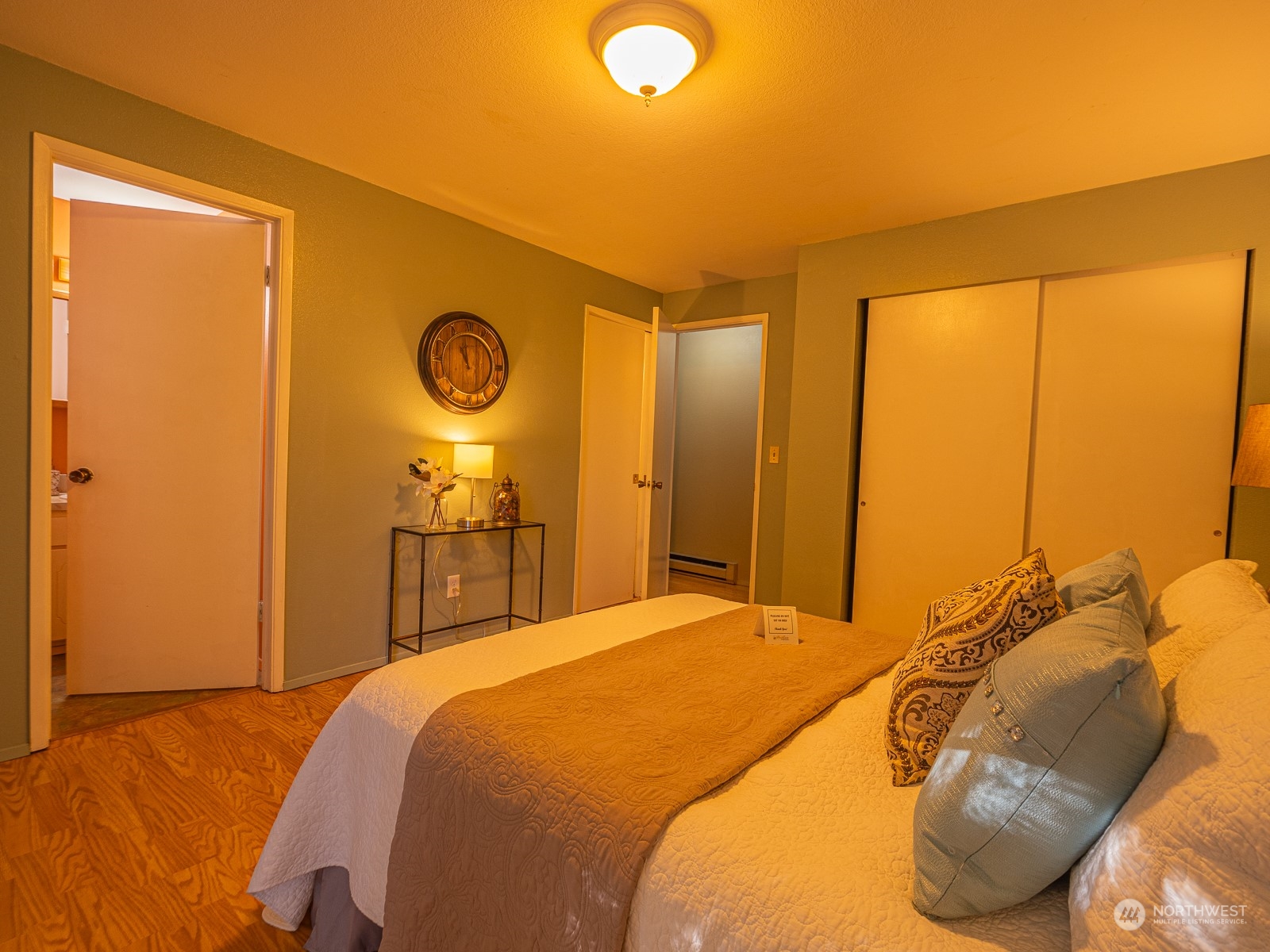 21425 Damson Road Bothell, WA 98021 - Photo 19 of 25 a bedroom with a bed and a lamp