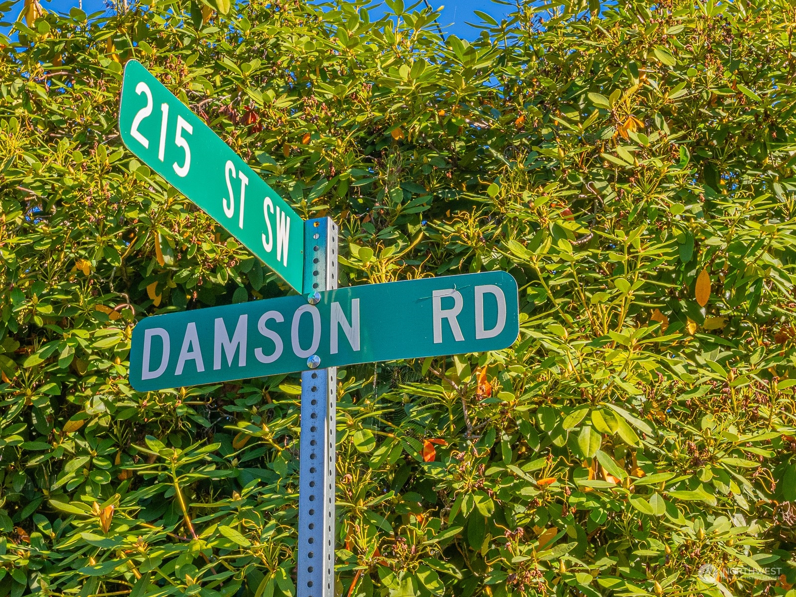 21425 Damson Road Bothell, WA 98021 - Photo 25 of 25 a street sign that is on a pole
