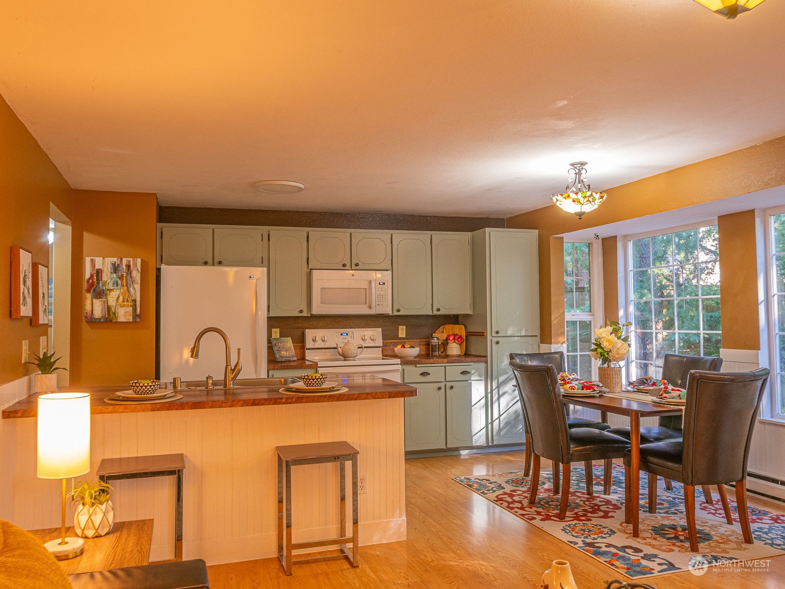 21425 Damson Road Bothell, WA 98021 - Photo 10 of 25 a kitchen with large windows and cabinets