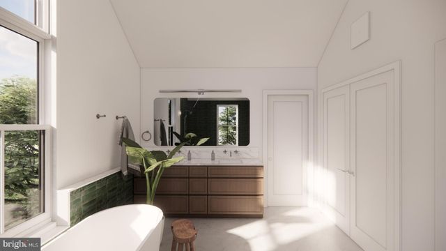 a bed room with a bed window and a flat screen tv